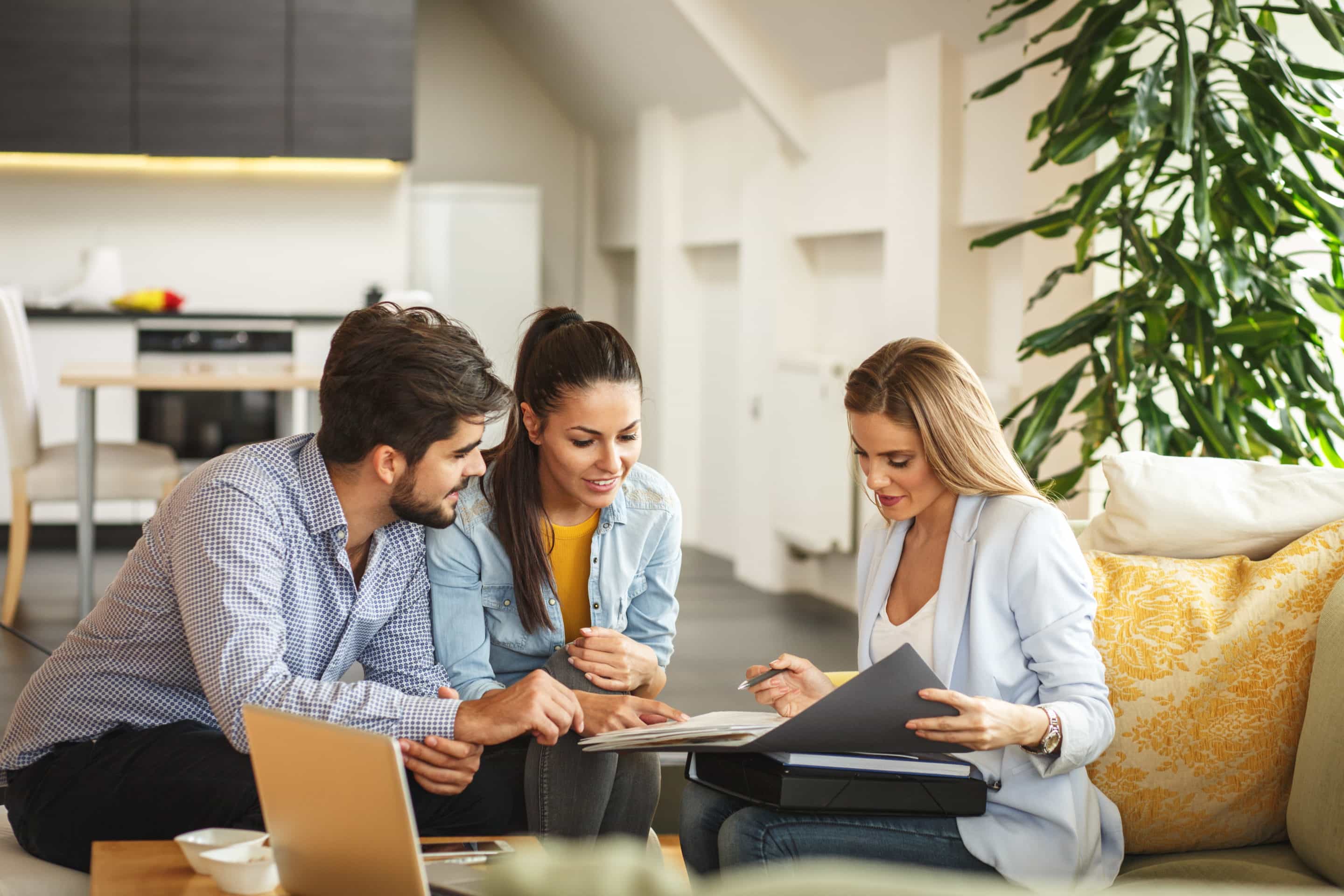 Female mortgage broker talking to clients